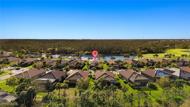 drone / aerial view featuring a residential view and a water view