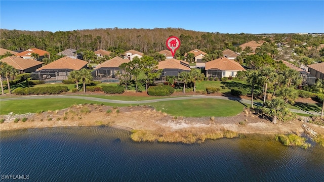 birds eye view of property with a residential view and a water view