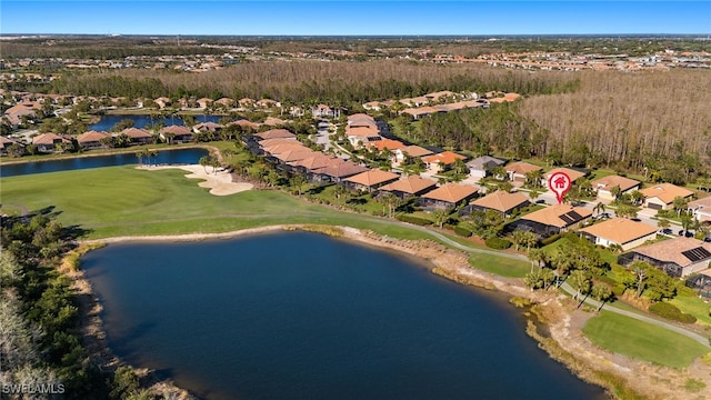 birds eye view of property featuring a residential view and a water view