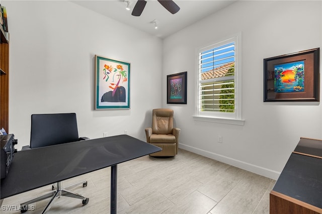 office space with ceiling fan, baseboards, and wood finished floors