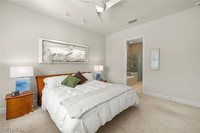 bedroom with visible vents, ensuite bath, baseboards, light colored carpet, and ceiling fan