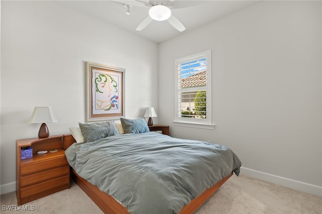 bedroom featuring baseboards, carpet floors, and ceiling fan