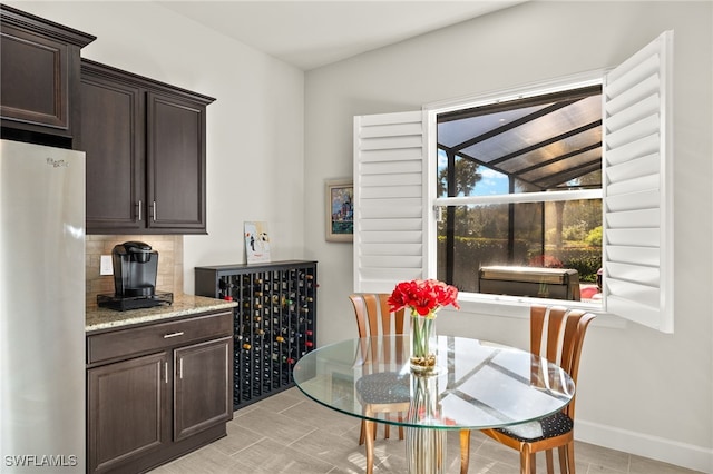 dining room featuring baseboards