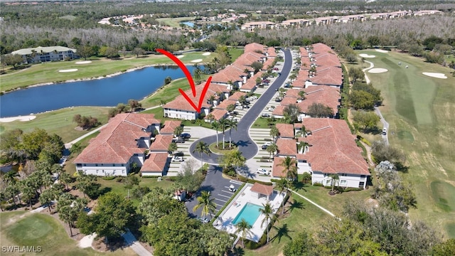 aerial view with a water view and golf course view