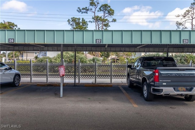 covered parking lot with fence