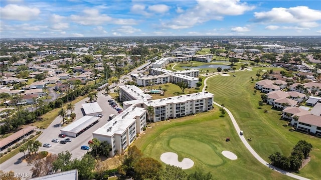 birds eye view of property with golf course view