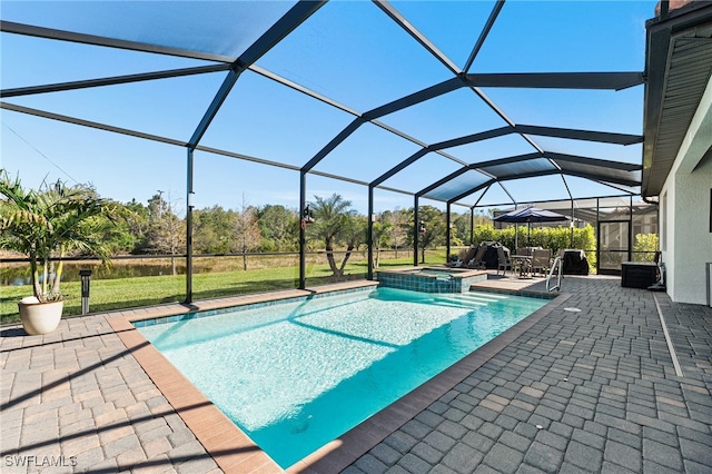 view of pool with a patio, a pool with connected hot tub, and a lanai