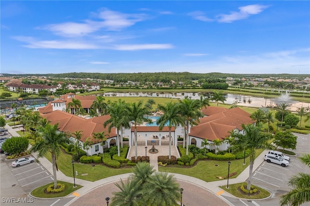 birds eye view of property with a water view