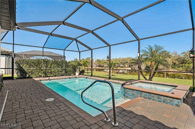 view of swimming pool featuring a lanai, a patio area, and a pool with connected hot tub