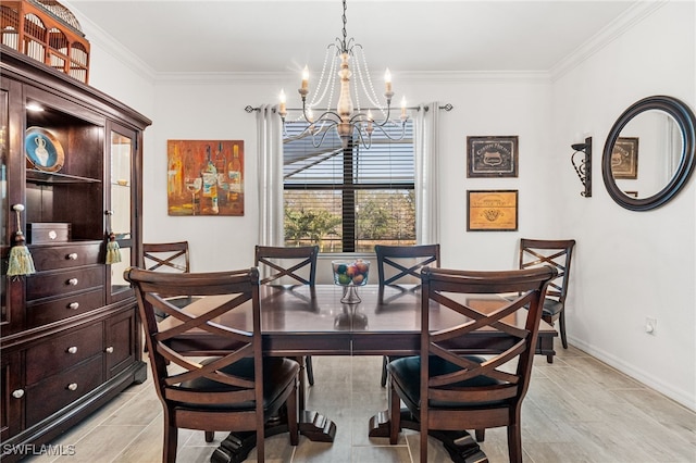 dining space featuring baseboards, a notable chandelier, and crown molding