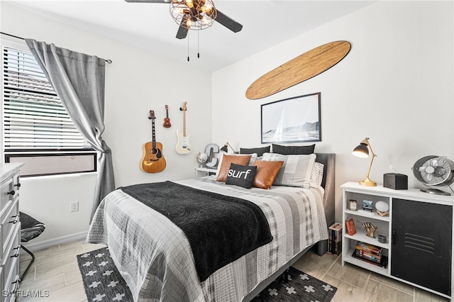 bedroom with baseboards and ceiling fan