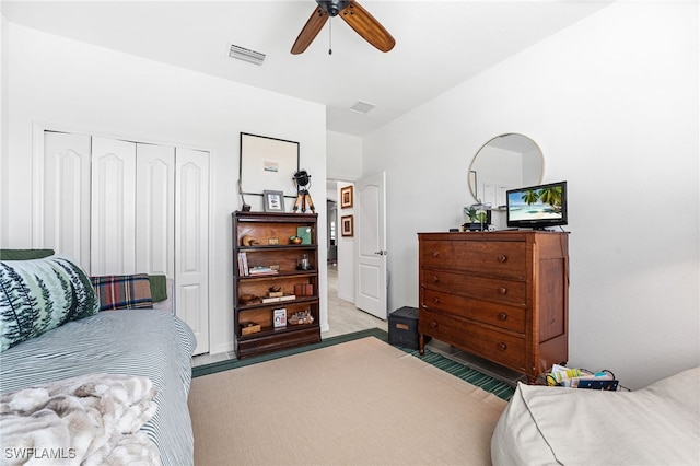 bedroom with a closet, visible vents, ceiling fan, and carpet floors