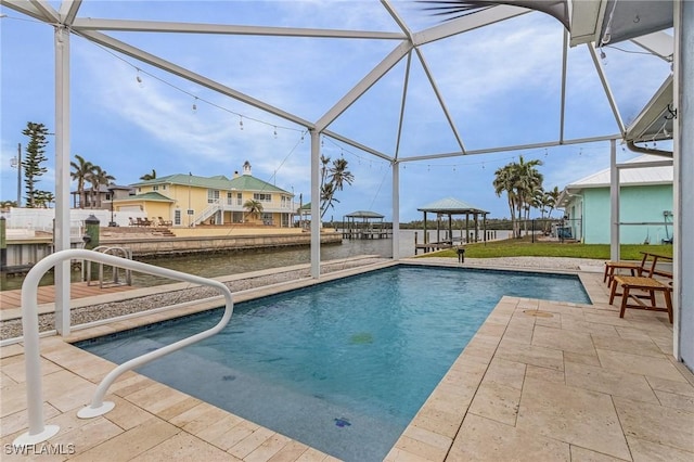 outdoor pool featuring a gazebo, glass enclosure, and a patio