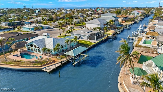 aerial view featuring a residential view and a water view