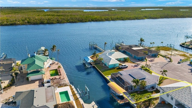 bird's eye view featuring a residential view and a water view