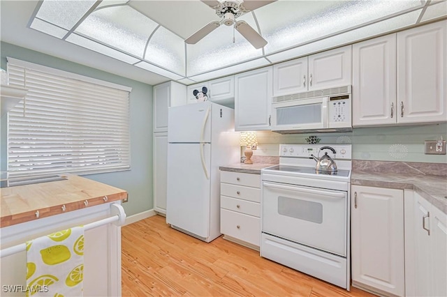 kitchen featuring ceiling fan, white appliances, butcher block countertops, white cabinetry, and light wood finished floors