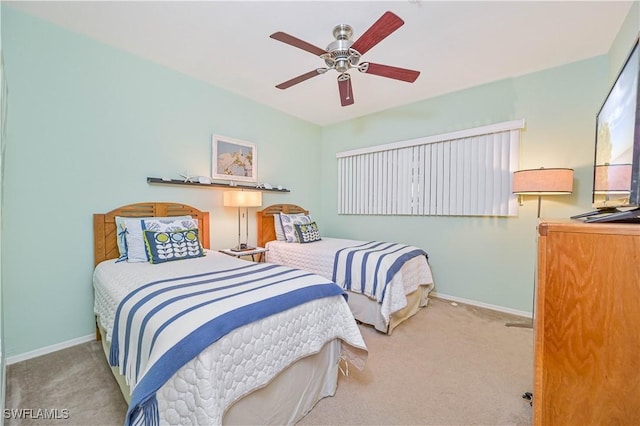 bedroom featuring a ceiling fan, carpet, and baseboards