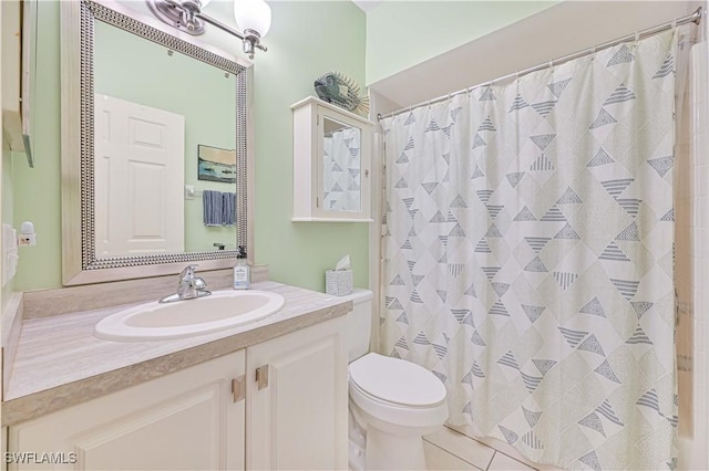 bathroom featuring toilet, tile patterned floors, a shower with shower curtain, and vanity