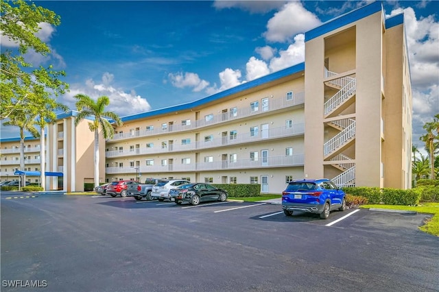 view of property featuring uncovered parking