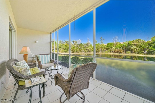 sunroom / solarium with a water view