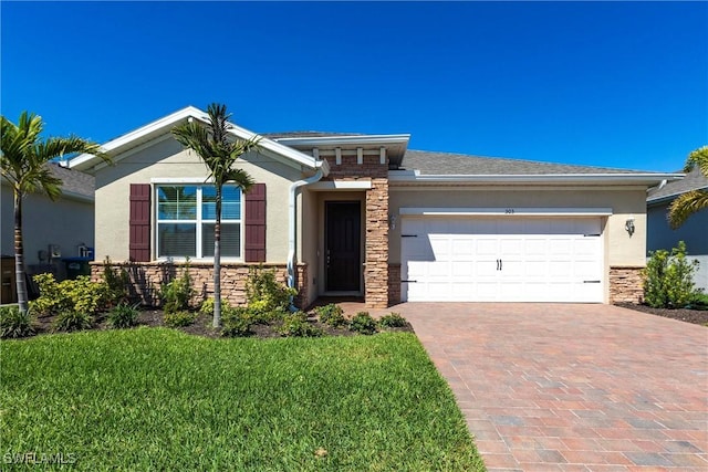 view of front of property featuring a garage, stone siding, decorative driveway, and stucco siding