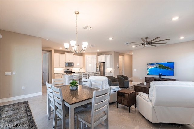 dining room featuring light tile patterned floors, recessed lighting, visible vents, baseboards, and ceiling fan with notable chandelier