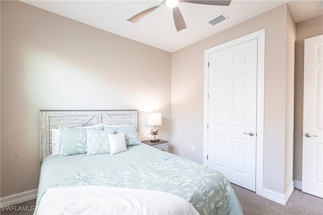 bedroom featuring a ceiling fan, carpet, visible vents, and baseboards