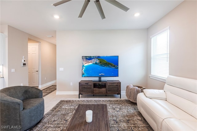 living room with ceiling fan, recessed lighting, and baseboards