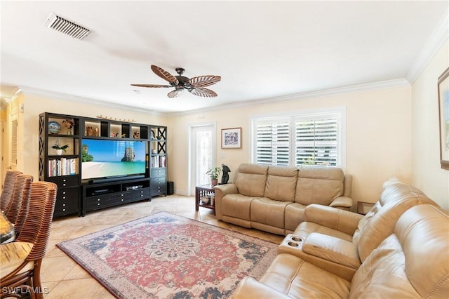 living area with crown molding, light tile patterned floors, visible vents, and ceiling fan