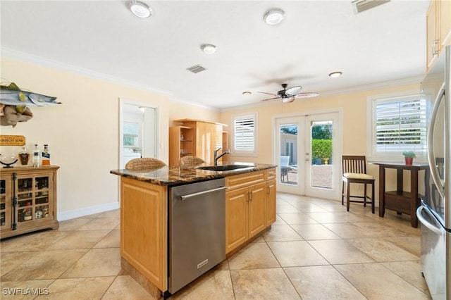 kitchen featuring french doors, visible vents, appliances with stainless steel finishes, and a sink