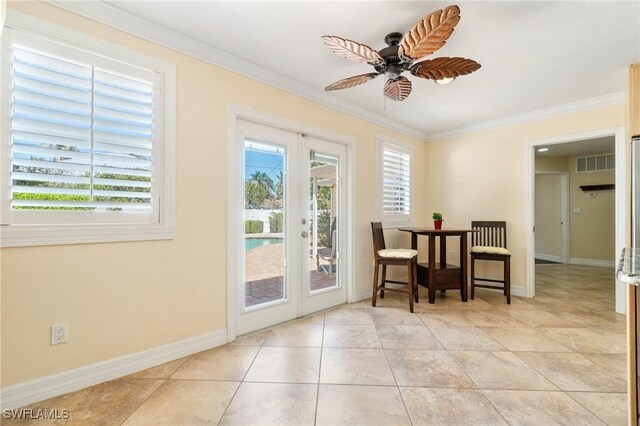doorway featuring crown molding, plenty of natural light, french doors, and visible vents