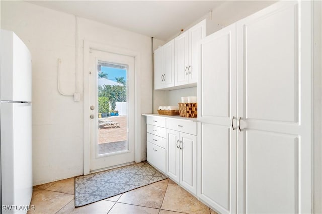 doorway to outside featuring light tile patterned floors