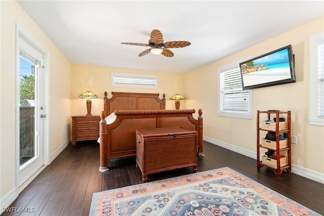 bedroom with baseboards, multiple windows, dark wood-style flooring, and access to outside