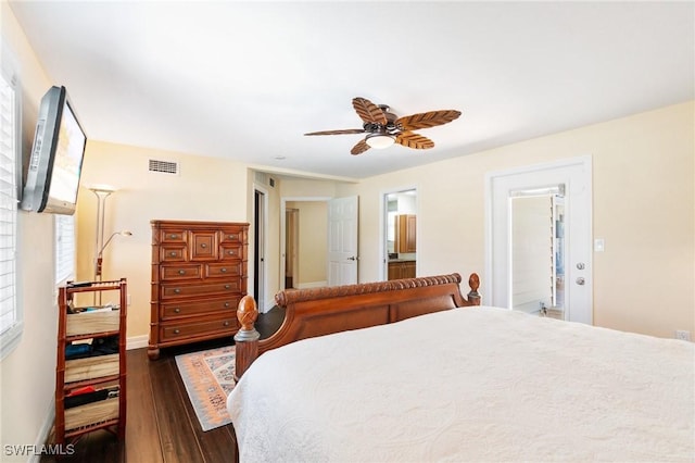 bedroom with visible vents, ceiling fan, baseboards, dark wood-style floors, and ensuite bath