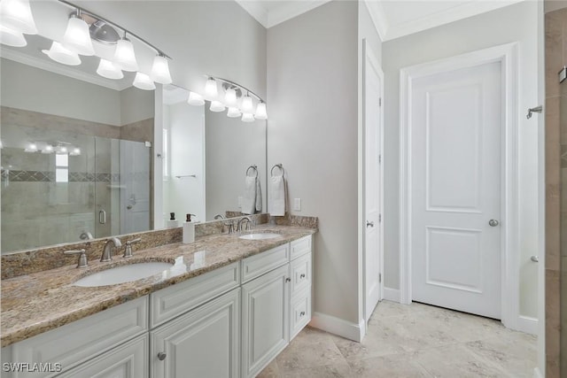 bathroom featuring ornamental molding, a sink, a shower stall, and double vanity