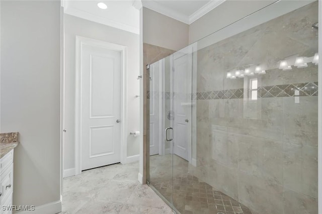 bathroom featuring baseboards, a shower stall, vanity, and crown molding