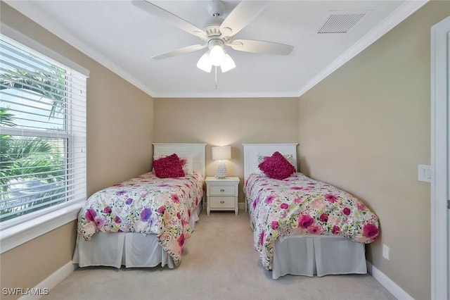 bedroom featuring light colored carpet, visible vents, ornamental molding, a ceiling fan, and baseboards