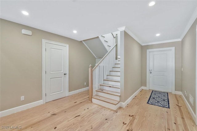 entrance foyer featuring light wood-type flooring, stairway, baseboards, and recessed lighting