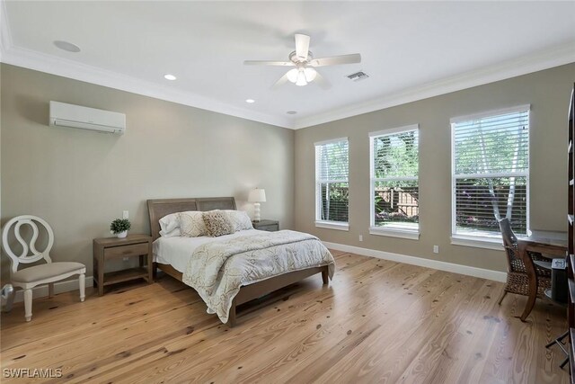 bedroom featuring multiple windows, visible vents, ornamental molding, and a wall mounted AC