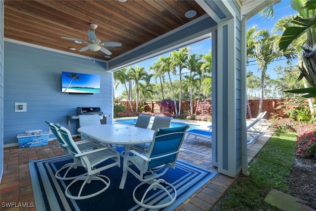 view of patio / terrace featuring ceiling fan, outdoor dining space, a fenced backyard, and a grill