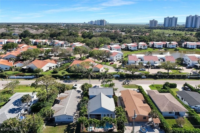 drone / aerial view featuring a residential view and a city view