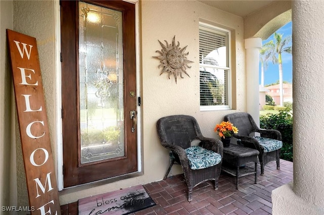 entrance to property with stucco siding