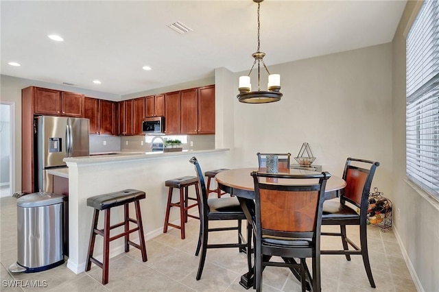 dining space featuring visible vents, recessed lighting, a chandelier, and light tile patterned flooring