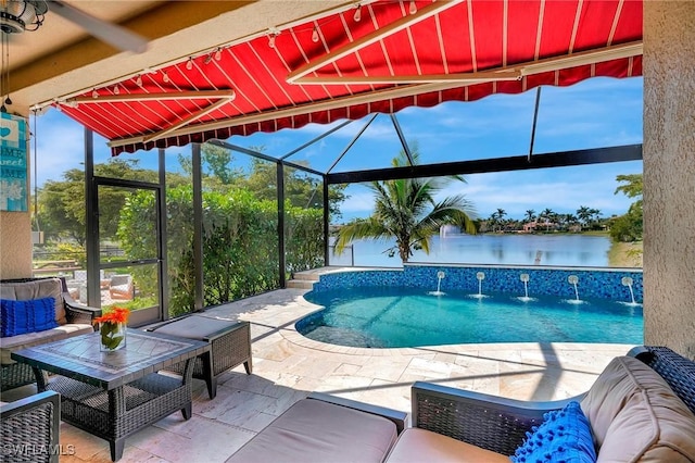 pool with a patio, an outdoor hangout area, and a water view