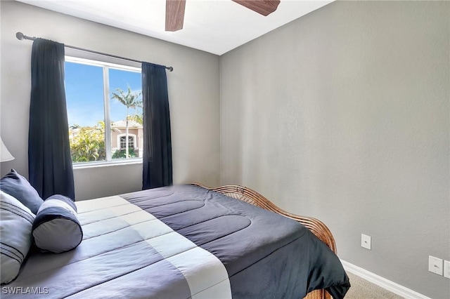 bedroom featuring ceiling fan, carpet floors, and baseboards