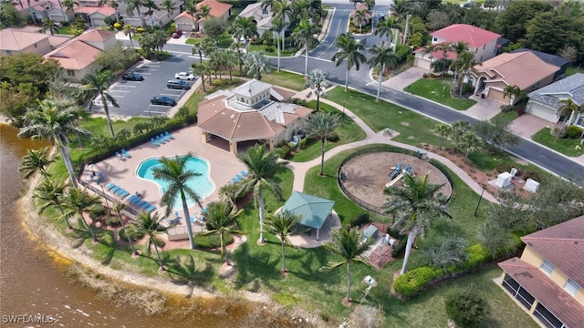 bird's eye view featuring a residential view and a water view