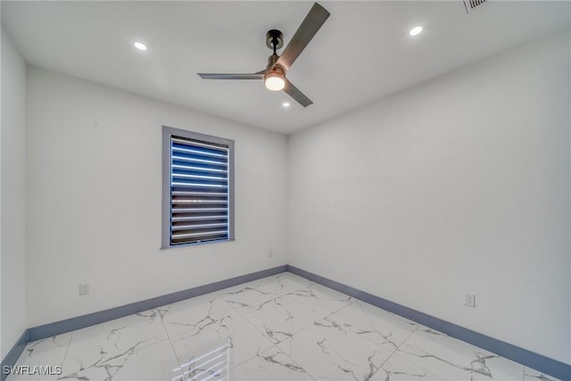 empty room featuring marble finish floor, baseboards, a ceiling fan, and recessed lighting