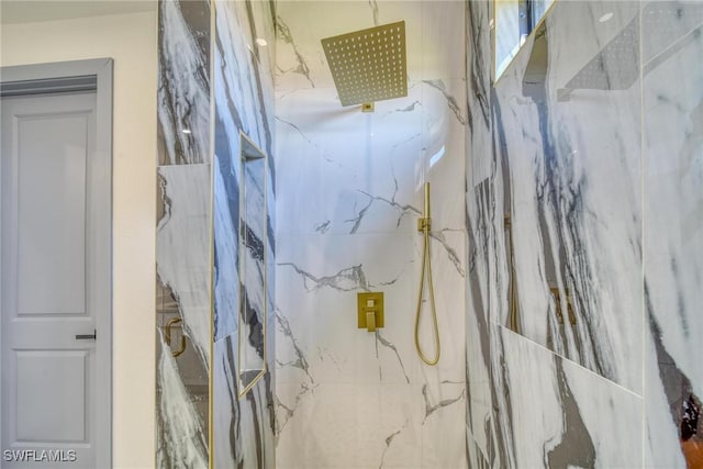 full bathroom featuring a marble finish shower