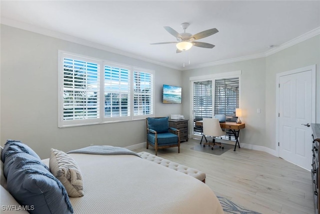 bedroom featuring ornamental molding, baseboards, light wood finished floors, and a ceiling fan