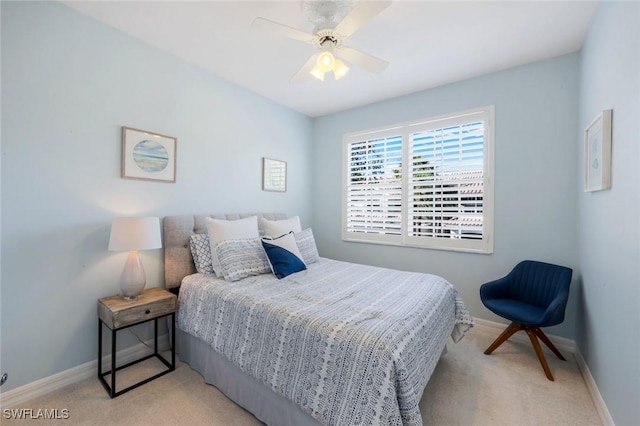 bedroom with baseboards, ceiling fan, and light colored carpet